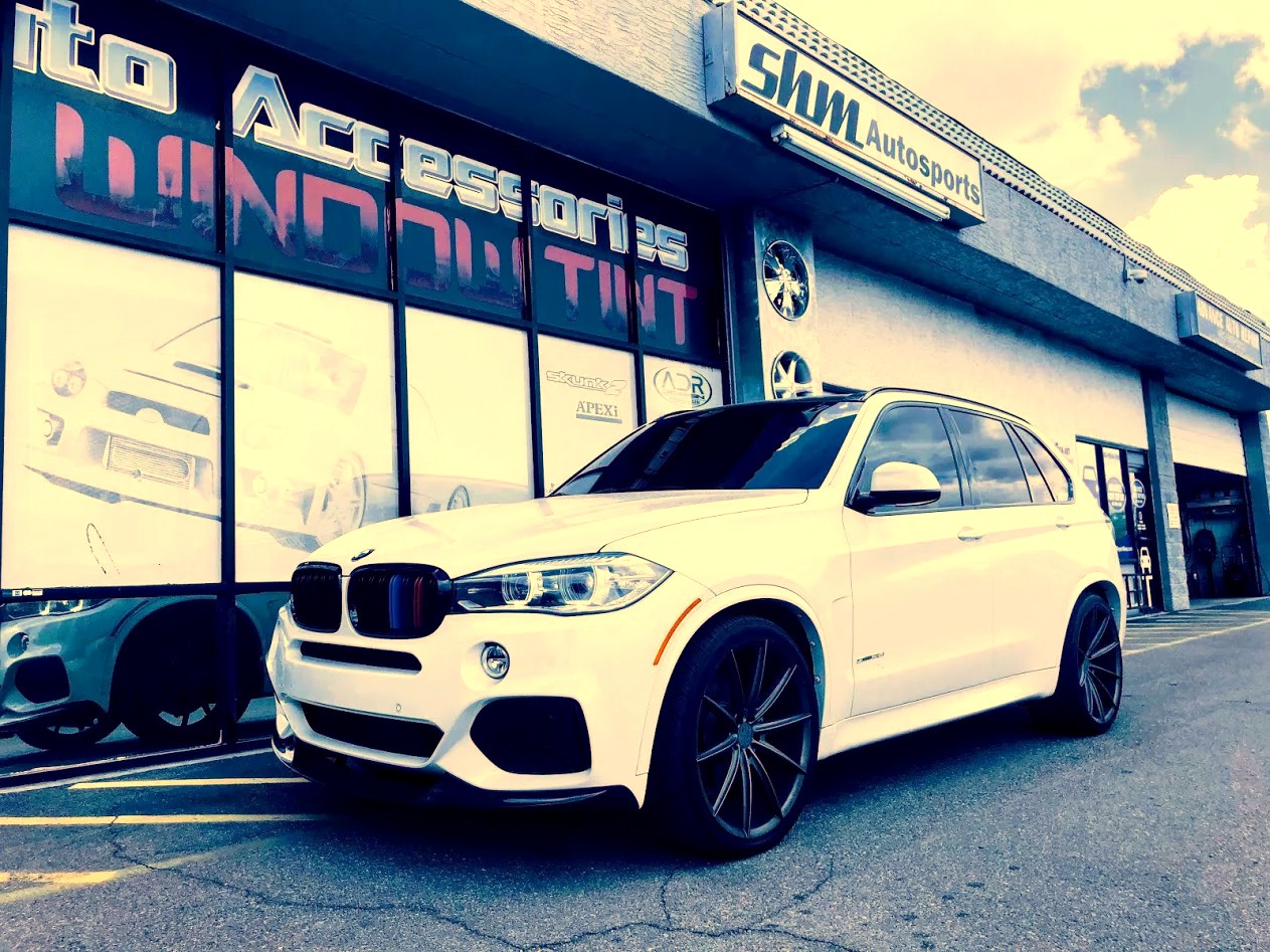 White BMW X5 on 22-inch custom wheels at SHM Motorsports
