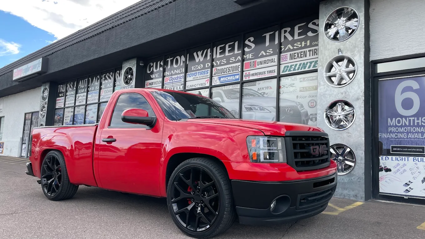 2011 GMC Sierra 1500 2WD with 5/7 Belltech lowering kit and 22-inch gloss black OEM LTZ wheels