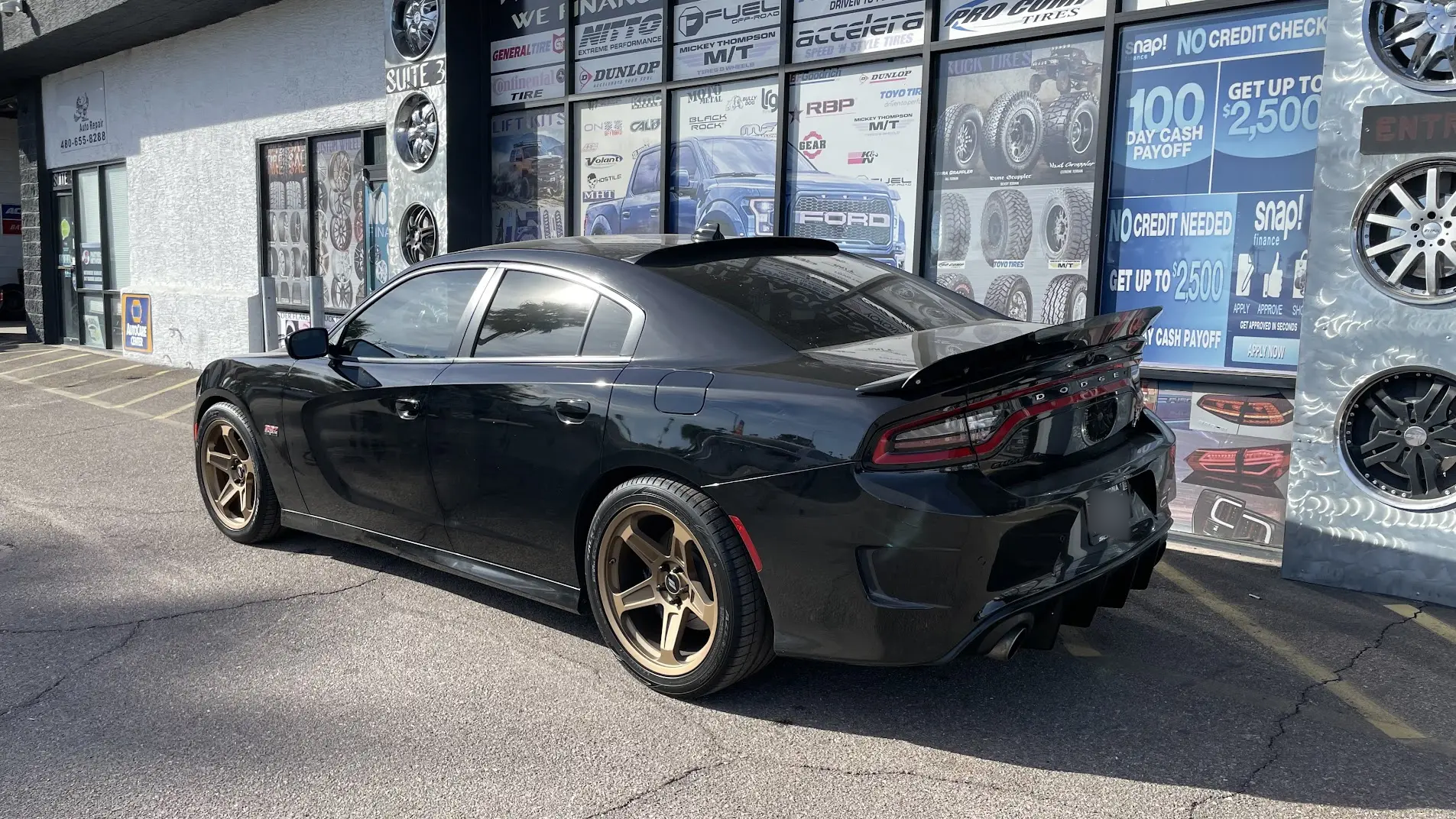 Rear view of a 2023 Dodge Charger Scat Pack with a wicker-bill rear spoiler installed by SHM Motorsports