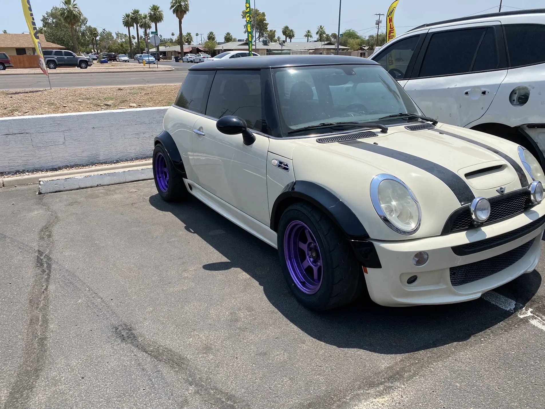 MINI Cooper with painted custom fender flares and purple wheels