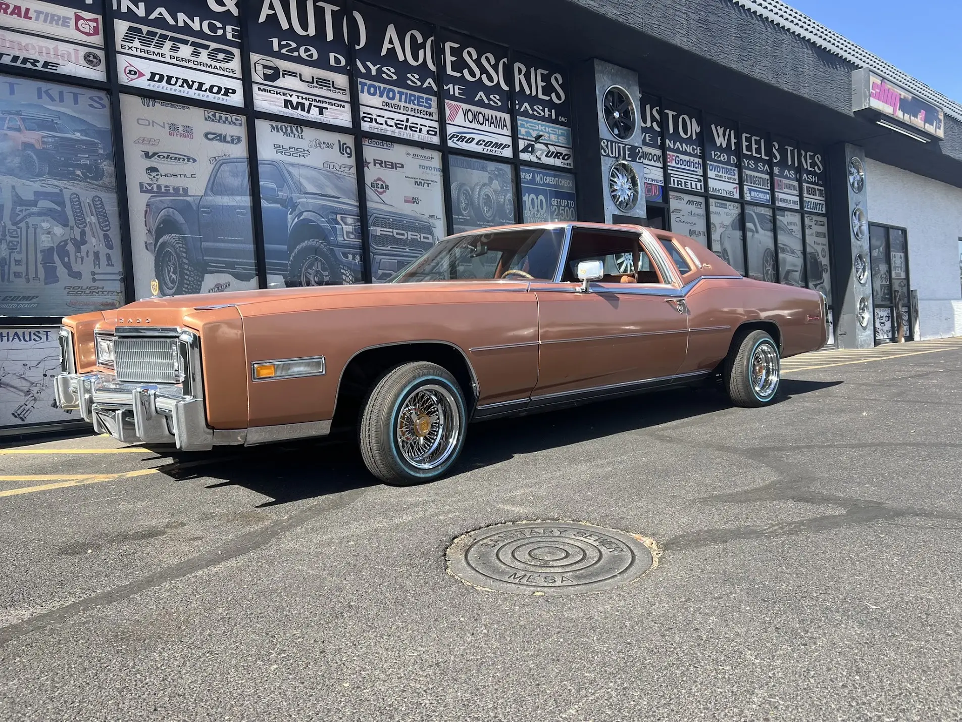 Cadillac on 13x7 wire wheels with whitewall tires
