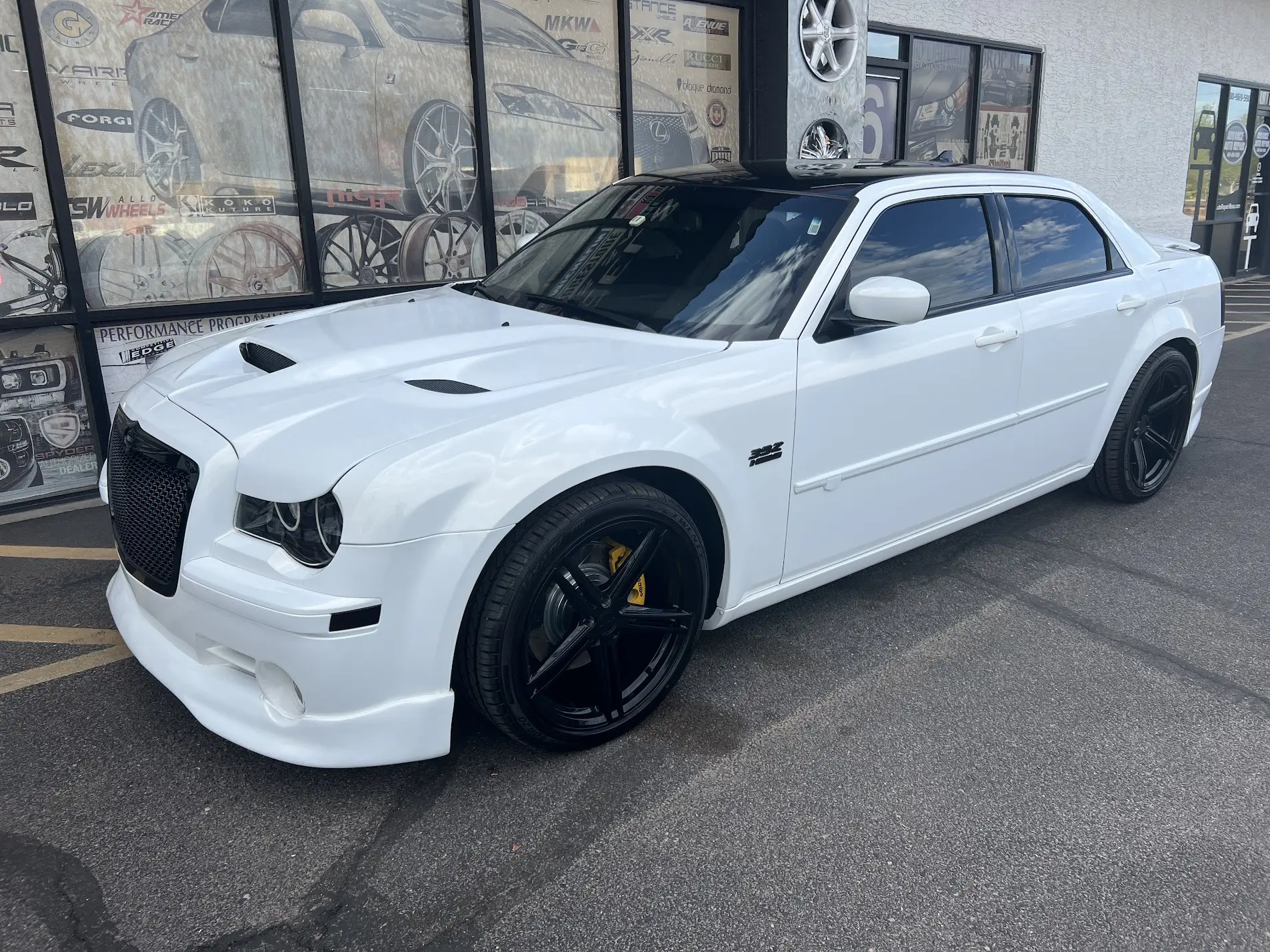 Pearl white Chrysler 300 on custom black wheels at SHM Motorsports