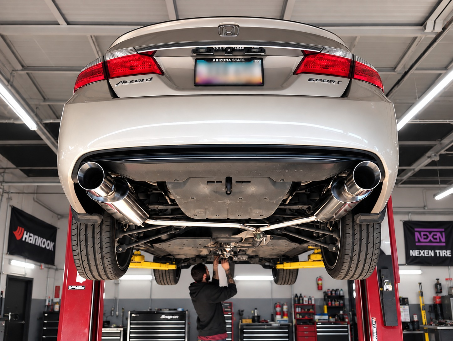 2017 Honda Accord Sport on the lift showing the custom GReddy dual exhaust system installed at SHM Motorsports