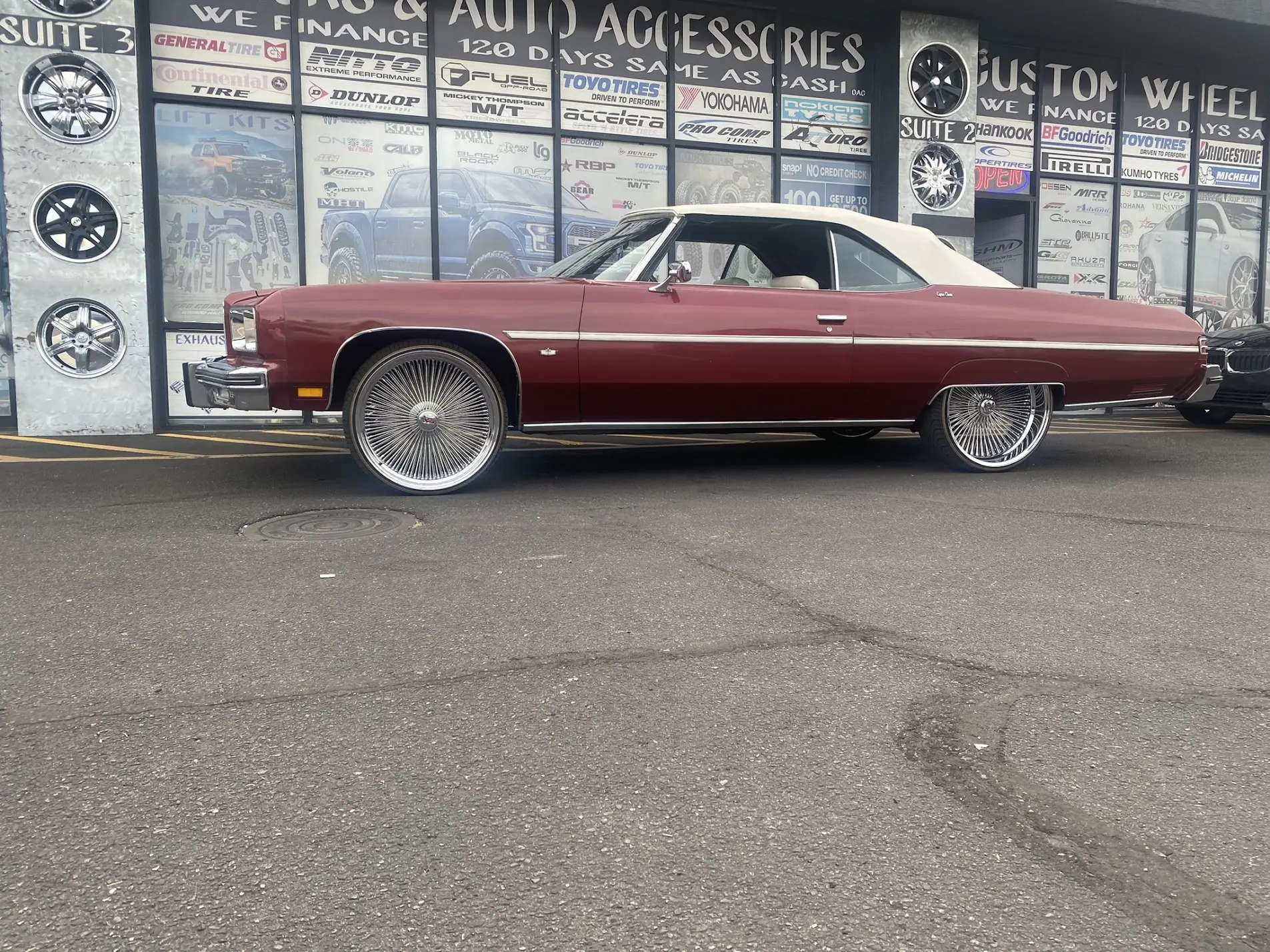 1975 Chevrolet Caprice Classic side view on 24x10 Dayton wire wheels with 305/30R24 Vogue tires