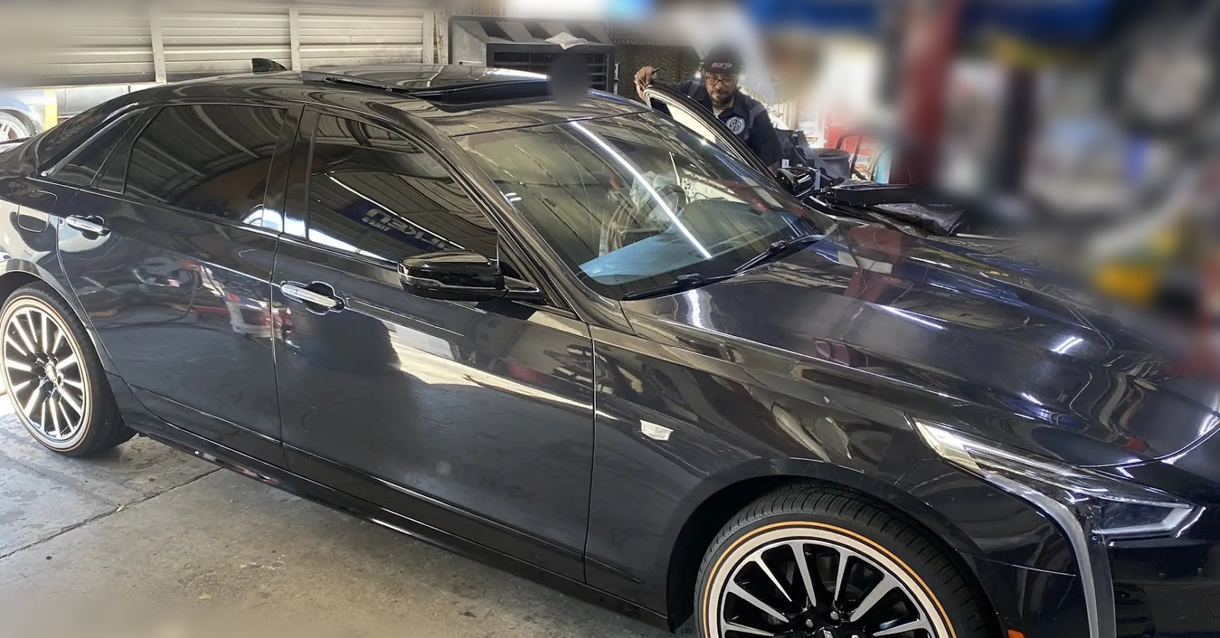 Cadillac sedan with full ceramic coating, complete ceramic tint, 240/40R20 Vogue tires on factory wheels and front-portion PPF
