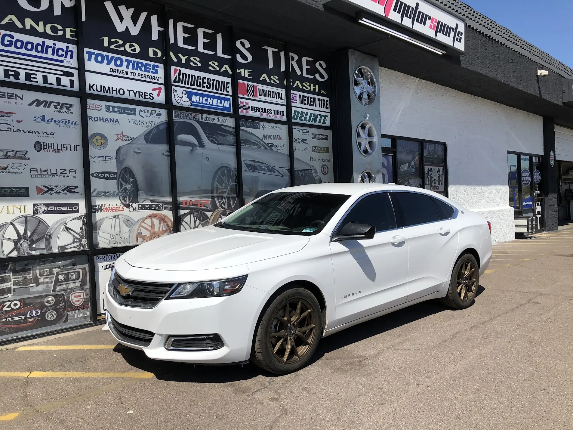 2022 Chevrolet Impala on 18-inch bronze-finish wheels with factory tires at SHM Motorsports