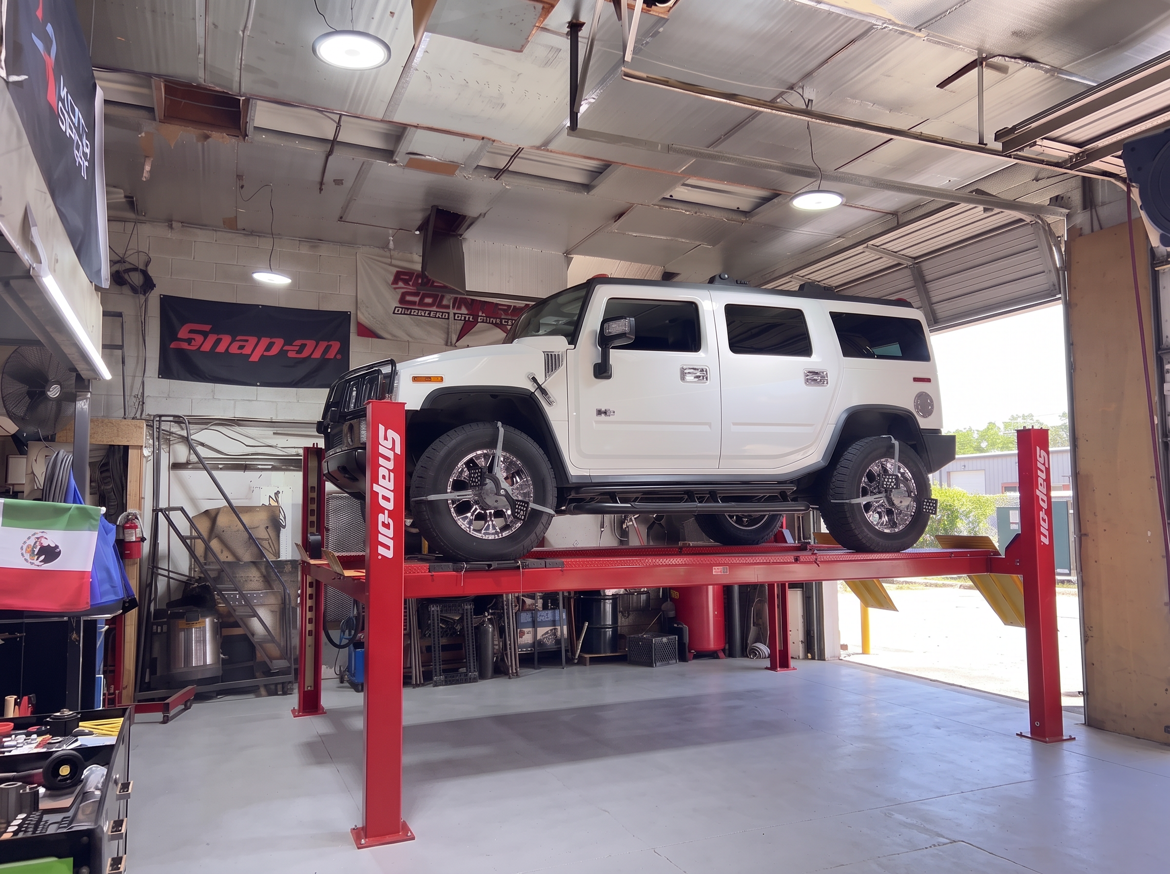 2005 Hummer H2 on 20x10 chrome XD Wheels with Nitto Terra Grappler tires receiving a four-wheel 3D alignment